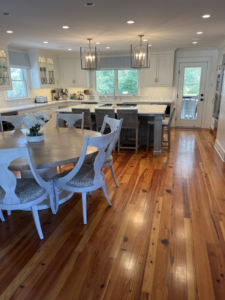 Open kitchen and dining area with a large island and pendant lights